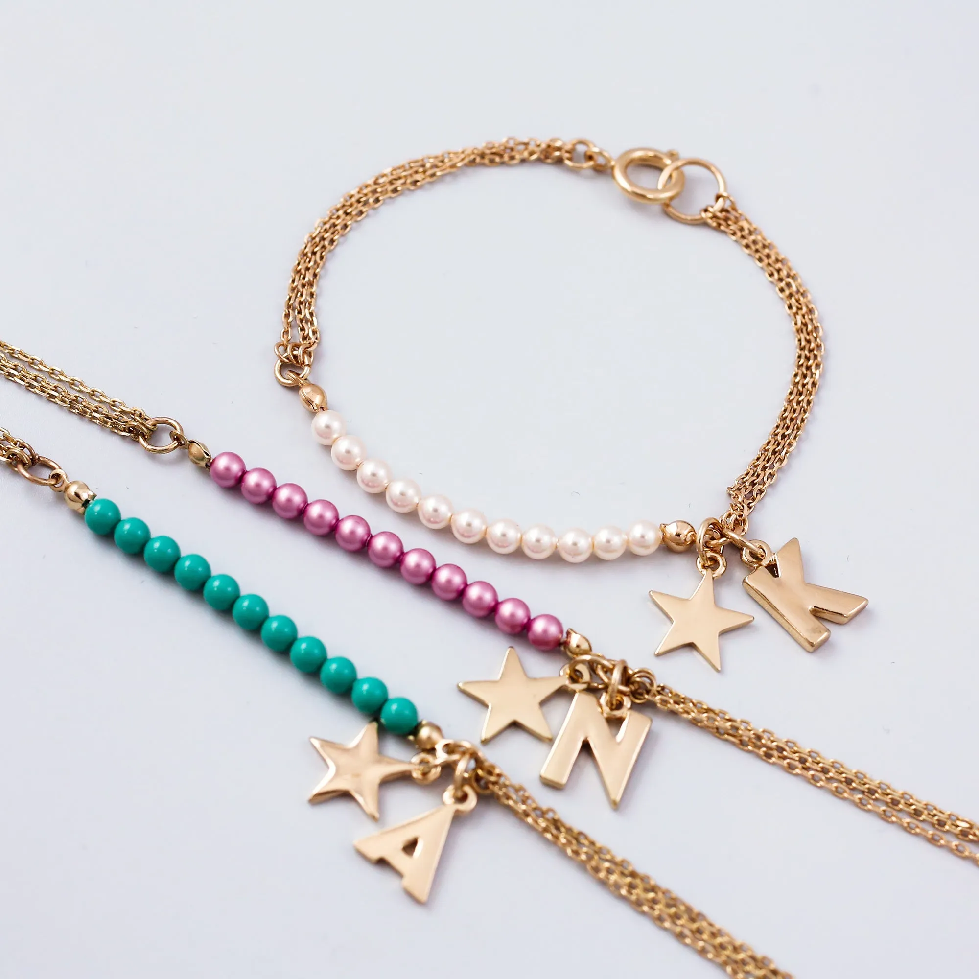 Personalised Gold Charm Bracelet Made with Pearls from Swarovski ®